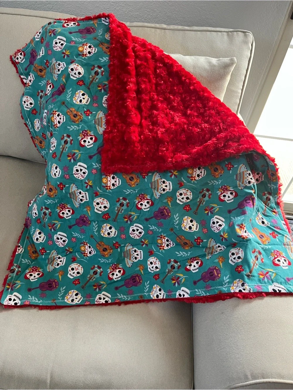 Homemade lap or baby blanket soft red rose minky & cotton flannel sugar skulls.